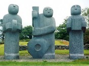 three stone musician statue