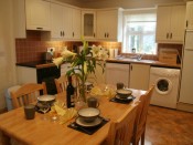 kitchen with dining table set for dinner