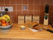 kitchen worktop with sliced brown bread